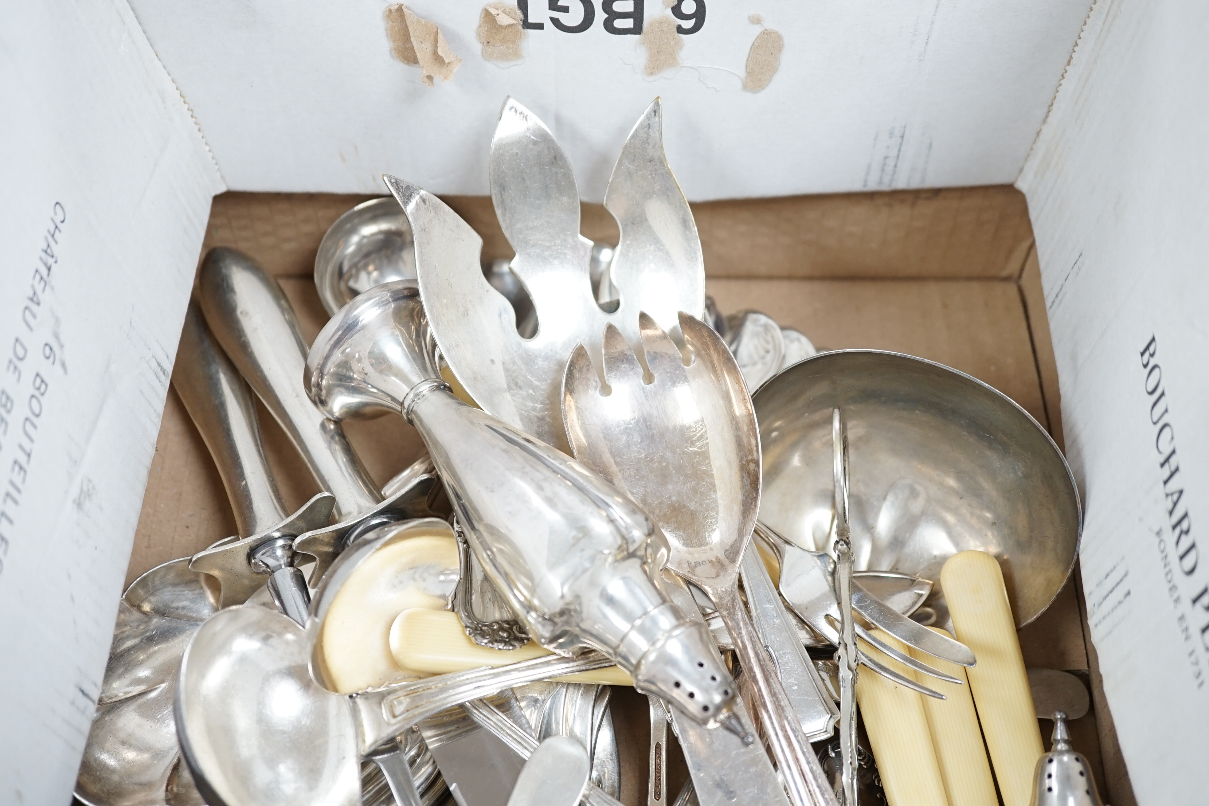 A pair of sterling pepperettes, five other sterling or 800 standard items of flatware and a quantity of silver plated flatware.